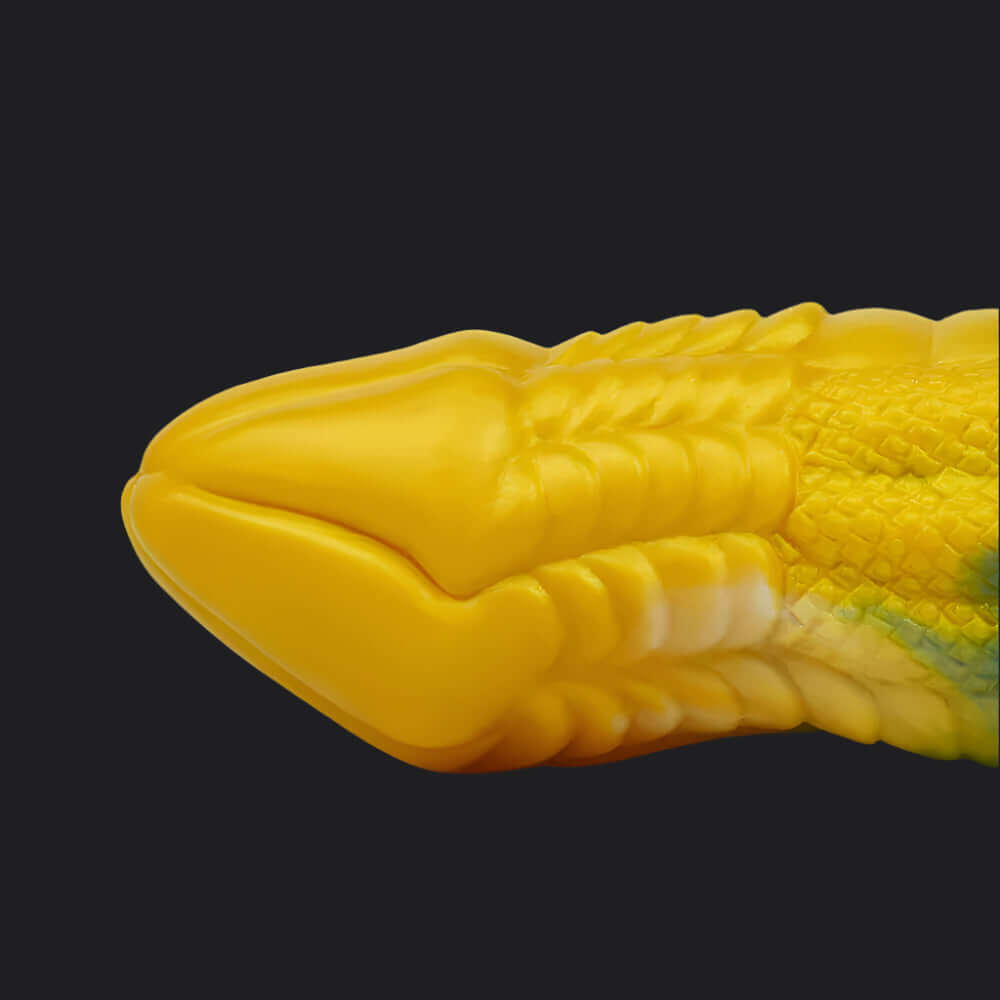 Io Dragon Penis Extender Sleeve - Yellow & Blue detailed view of the tapered tip and textured scales.