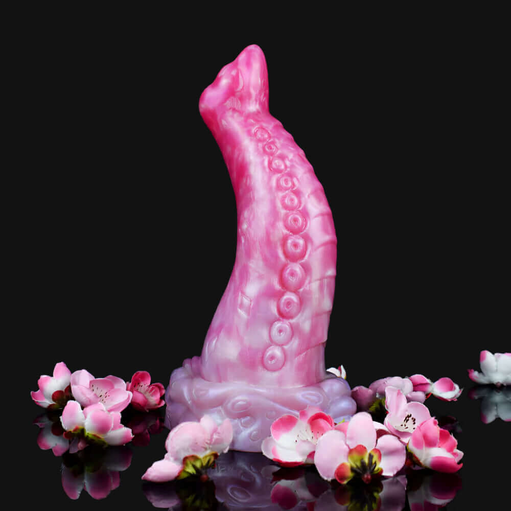 Swamp Monster Migas dragon dildo Europe, pink suction-cupped design with tentacle details and flower accents.