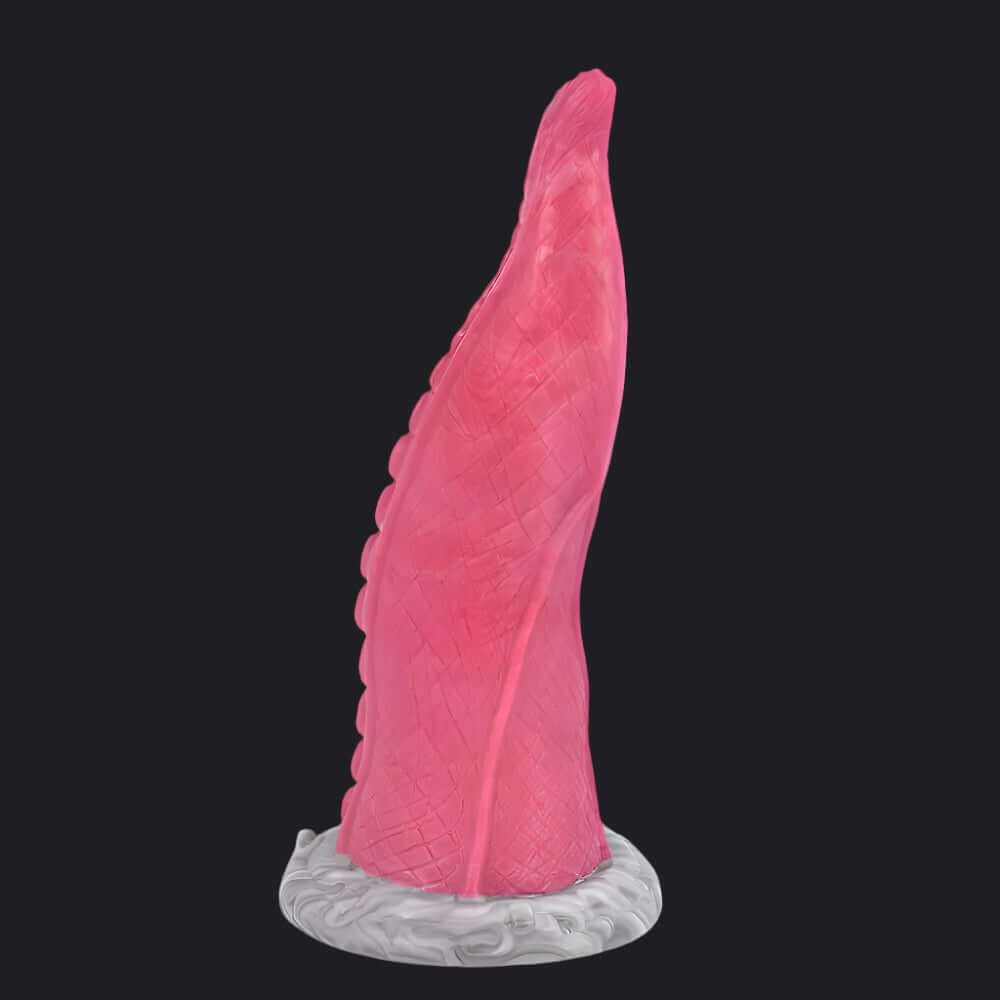 Octopus Tentacle Dildo showcasing its unique pink, curved design with a textured finish for enhanced pleasure.
