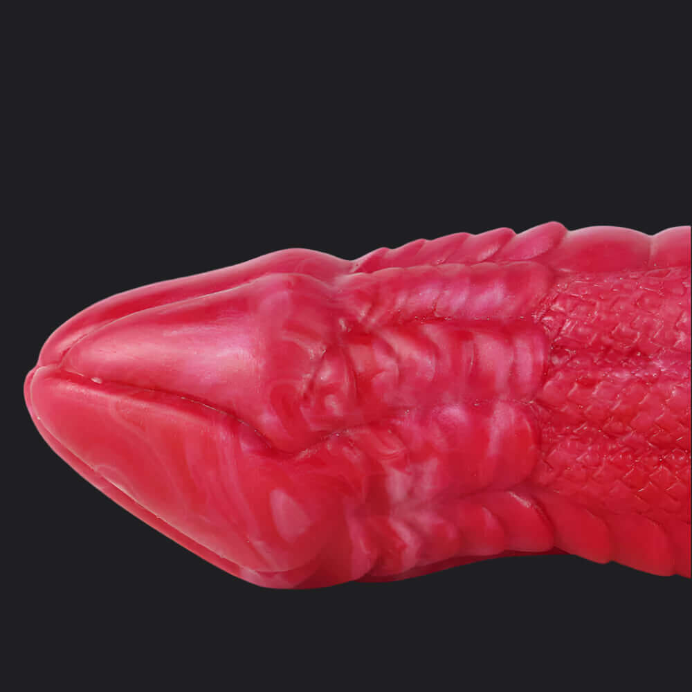 Io Dragon Penis Extender Sleeve - Red close-up showcasing the textured design and smooth tapered tip.