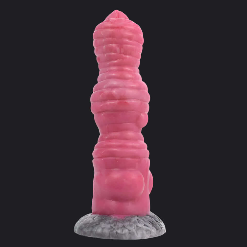 Ogre Dildo in pink, featuring a ribbed head and shaft, designed for pleasure, perfect for those seeking a unique experience.