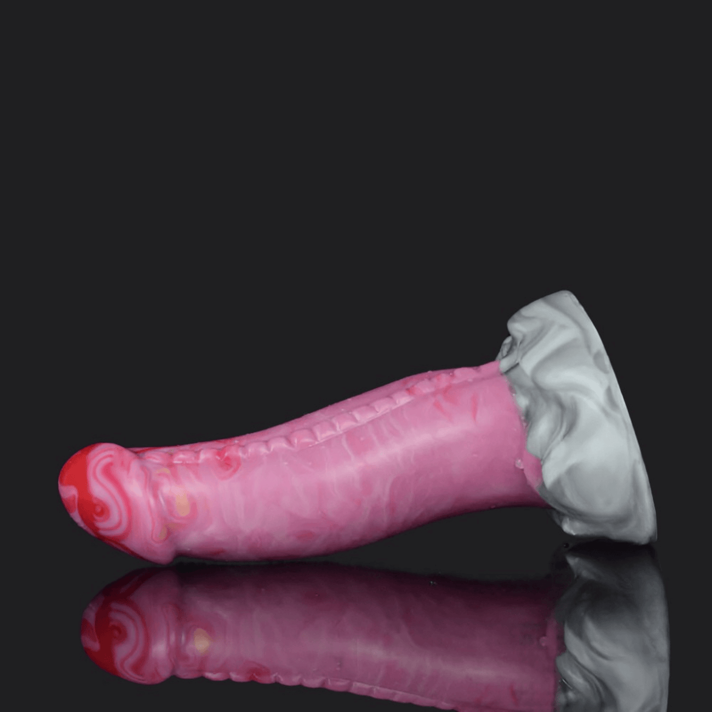 Colorful pink dragon dildo with a spiked base and smooth shaft, perfect for adventurous play.