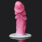 Dragon Dildo Scylla in vibrant pink color, showcasing detailed design and flared base for enhanced pleasure.