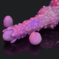 Neomorph Ovipositor Alien Dildo in vibrant purple and pink colors with textured surface and accompanying eggs.